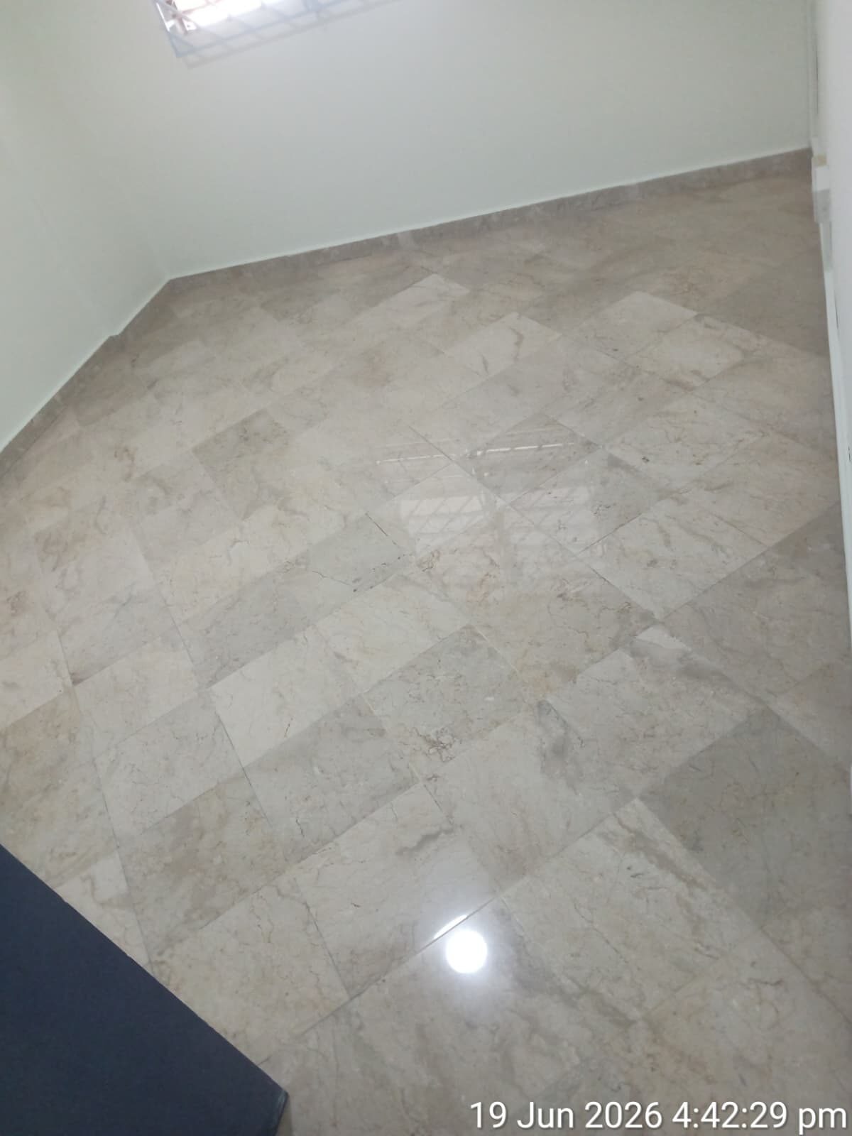 Freshly polished cream tile floor, second angle