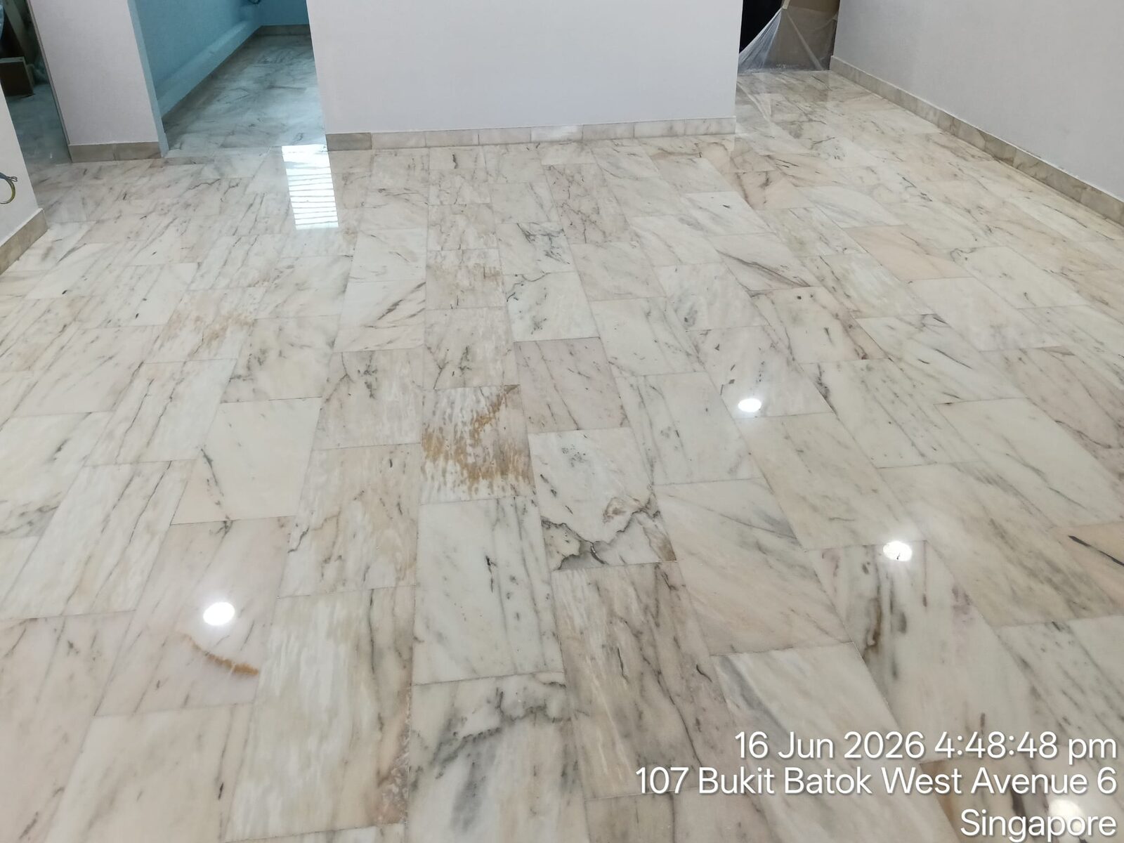 Freshly polished terrazzo hallway leading between rooms