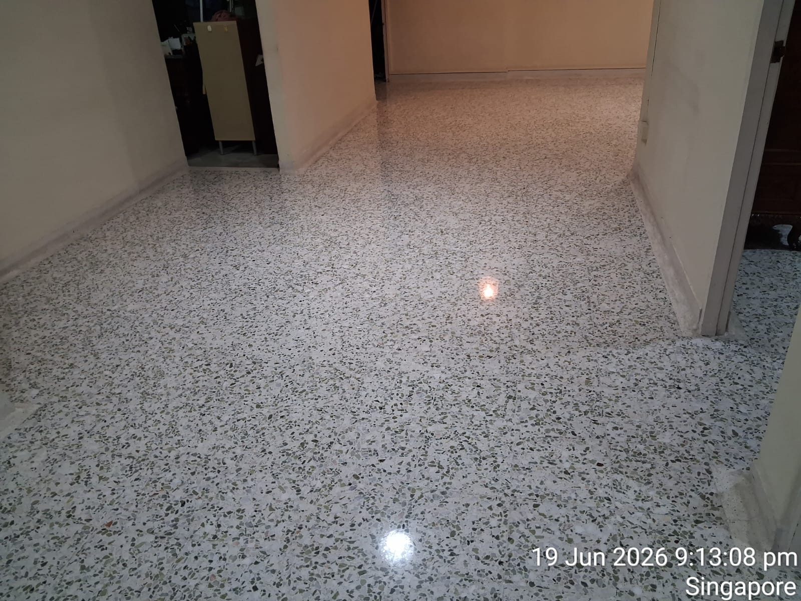 Freshly polished terrazzo corridor floor, bright and even