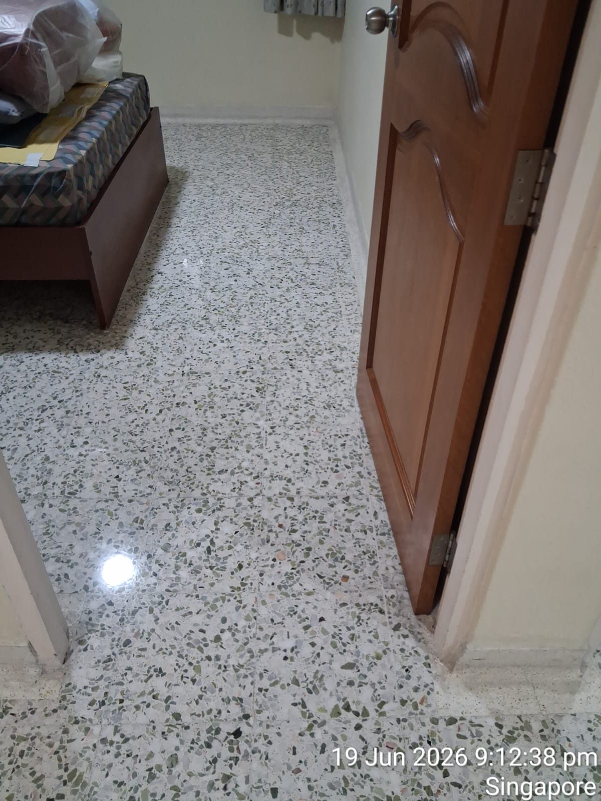 Freshly polished terrazzo corridor floor, bright and even — second photo