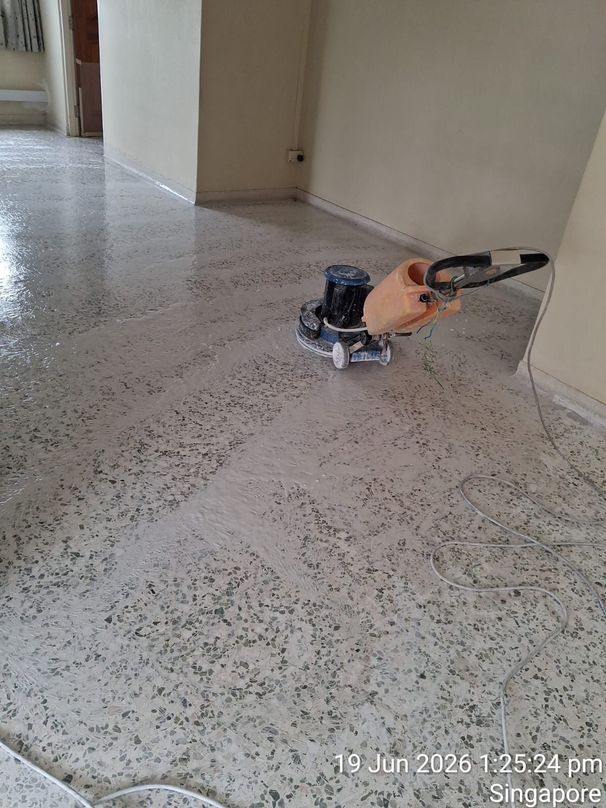 Freshly polished terrazzo master bedroom floor with wardrobe — second photo