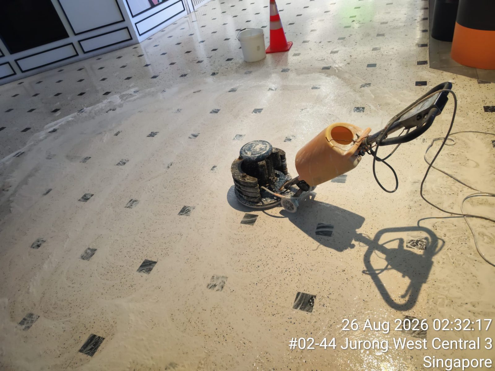 Freshly polished terrazzo corridor floor at Jurong Point Shopping Centre — second photo