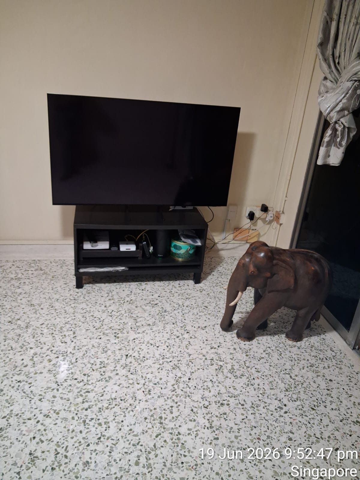 Freshly polished terrazzo living room floor with TV console