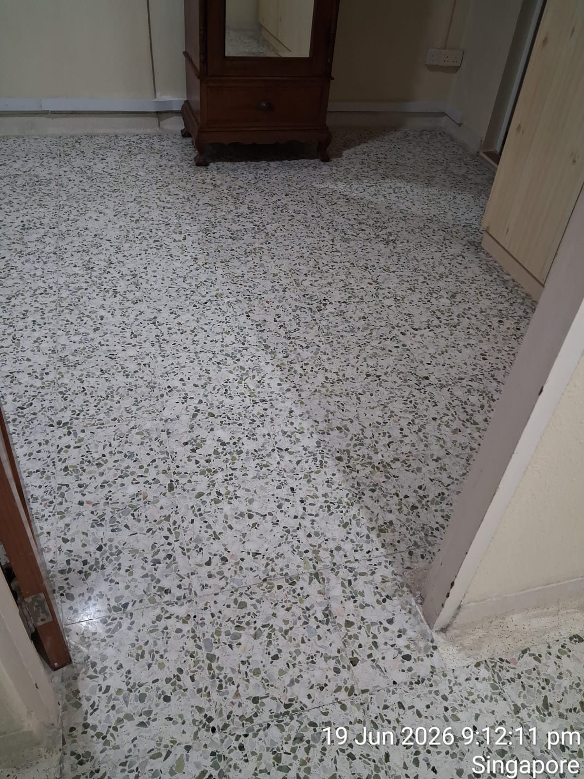 Freshly polished terrazzo master bedroom floor with wardrobe